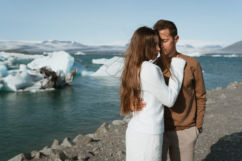 Magical moment as the couple explores Diamond Beach, the shimmering icebergs creating a fairytale backdrop for their love story