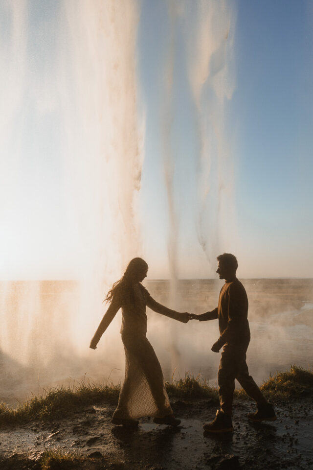 Captivating elopement scene with Seljalandsfoss waterfall as a picturesque backdrop