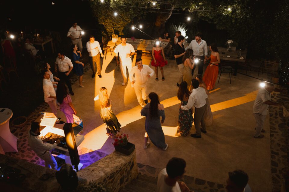 Night wedding party with dance floor lights in Greece