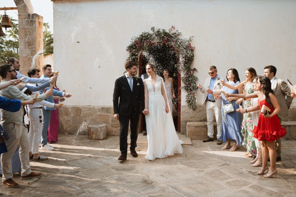 Bride and groom walking hand in hand after ceremony