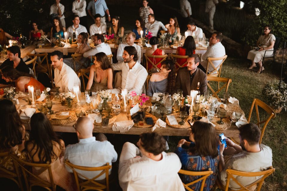 Guests enjoying dinner at destination wedding in Greece